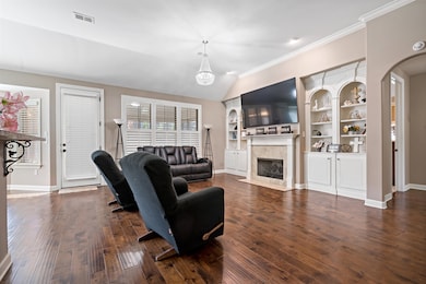 Living room with dark hardwood / wood-style floori