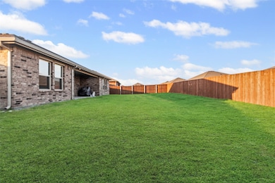 Fenced backyard featuring a patio area