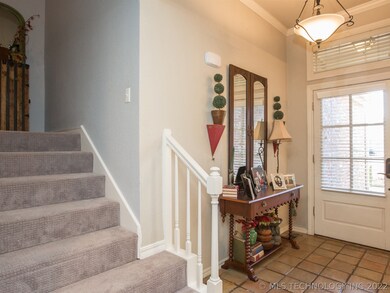 Saltillo tile floors flow throughout the entry hal