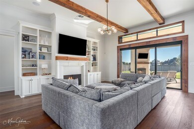 Living room with beam ceiling, crown molding, dark