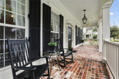 Southern style large brick front porch with gas la