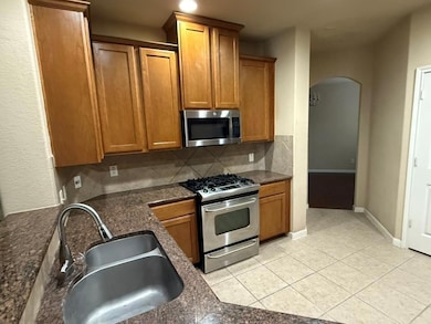 Kitchen featuring appliances with stainless steel