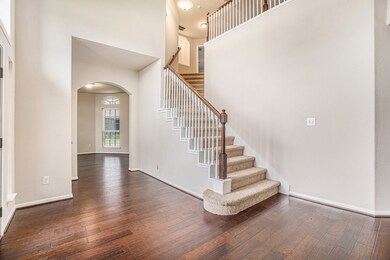 Bright and welcoming entryway with soaring ceiling