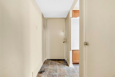 Hallway featuring baseboards