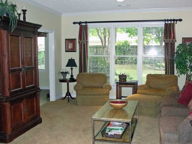 Light and airy great room looks out over pretty ba