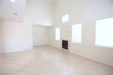 Dramatic entry with 19' ceilings and fireplace