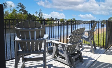 Wooden deck featuring a water view