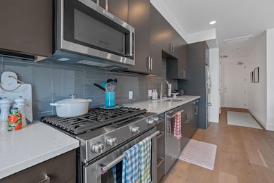Kitchen featuring appliances with stainless steel