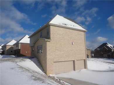 Other. View of rear yard and 3 car garage