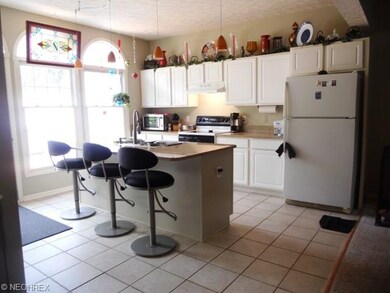 a beautiful kitchen with granite counters and isla