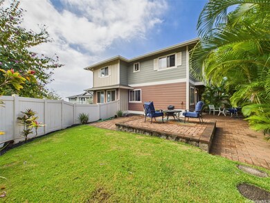 A beautifully landscaped backyard featuring a buil