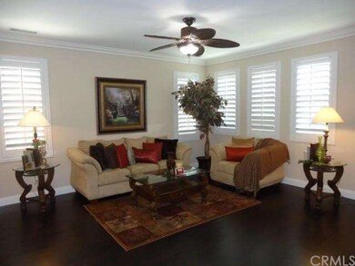 Gorgeous living room with crown molding and rich w