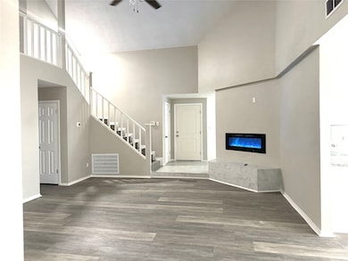 living room facing the front door. Formal dining r