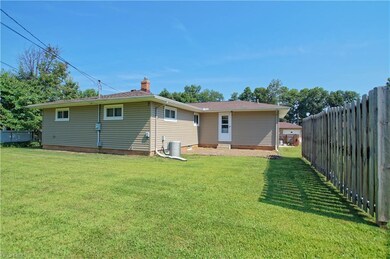 Lovely back yard with partially fenced yard courte