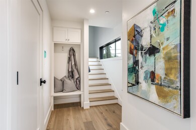 Mudroom featuring light wood-style flooring and recessed lighting