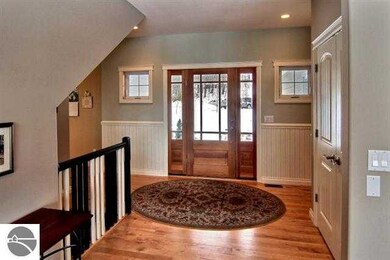 with beautiful wood front entry door.