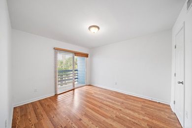 The master bedroom has Faux Wood Vinyl Plank Floor