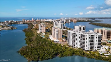 Aerial view featuring a water view and a city view