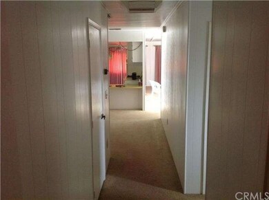 Hallway with bar entrance, looking towards the kit