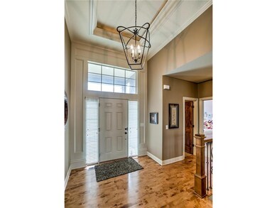 This home has upgrades lighting and gleaming wood 