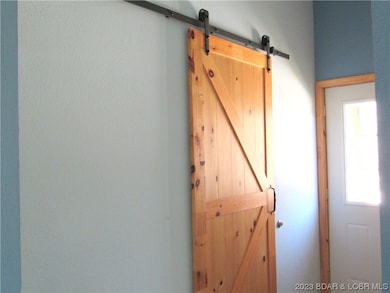 Barn door to utility room.