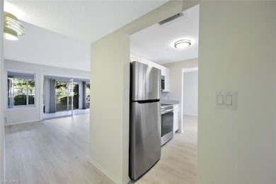 Kitchen with white cabinetry, stainless steel appl