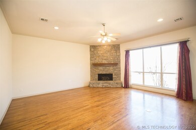 Great Room features stacked stone fireplace w/gas