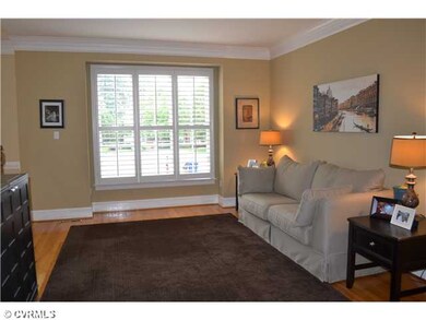 Living Room - Plantation shutters, wood floors