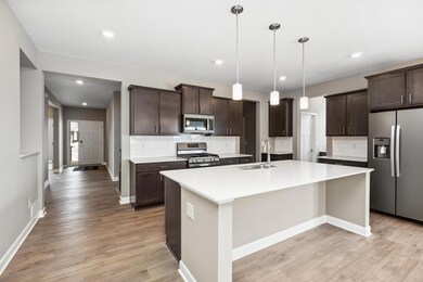 Check out that awesome island and all of those cabinets!