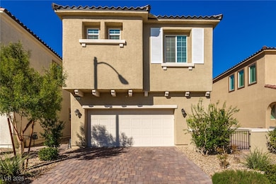Mediterranean / spanish house with stucco siding, decorative driveway, a garage, and a tiled roof