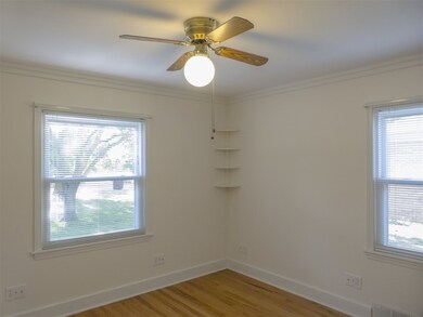 9 x 7 bedroom with hardwood floors, and a ceiling 