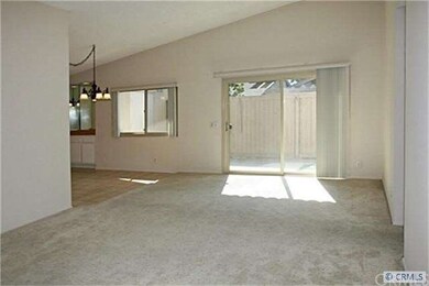 Huge living room with vaulted ceiling and slider l