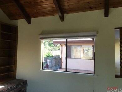 From living area, window faces master bedroom acro