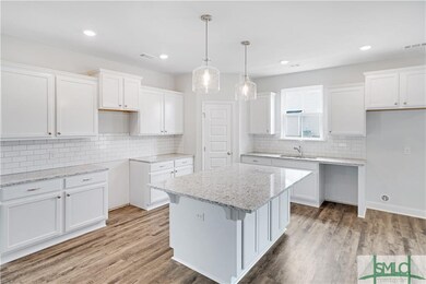 Kitchen with Large Island and tons of cabinet and 