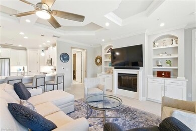Living area featuring baseboards, ornamental moldi