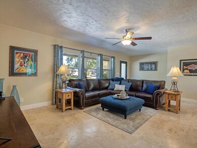 Welcome to your new home!  This spacious living room is just the beginning! Travertine floors, and newer windows!!
