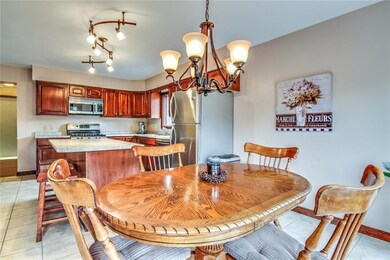 Eat-in-kitchen opens up to family room.