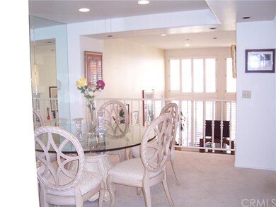 Formal dining room with wall of mirrors