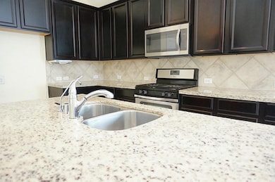 Large island for additional seating and entertaining