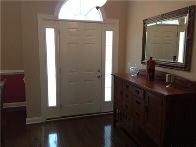 Foyer entry with sidelights and hardwood!