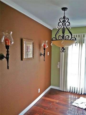 Dining area with newer lighting fixture