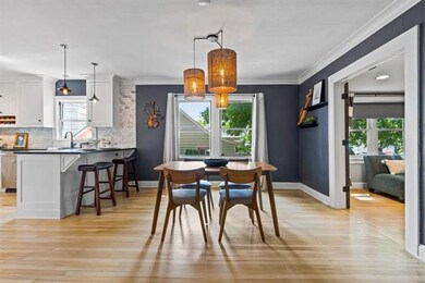 Gorgeous open dining/kitchen combo.