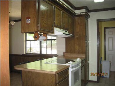 Open kitchen leading to dining area