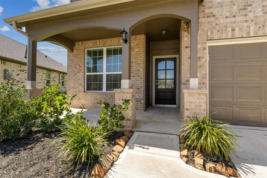 Charming brick home with a welcoming front porch,