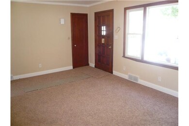 Living Room. Note the new carpet and nice lighting
