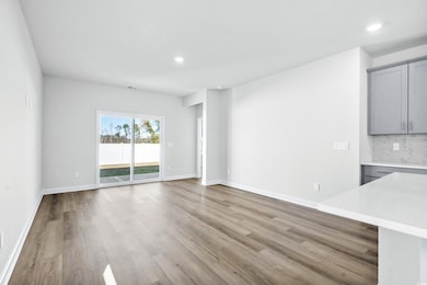 Unfurnished living room with light wood-type floor