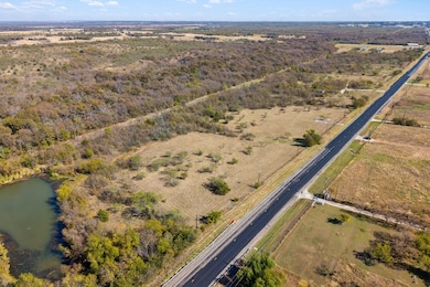 Aerial view of property's location with rural landscape