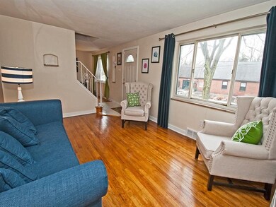 The main living room has hardwood floors and a lar