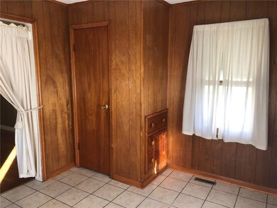Den has built in drawers and closet, easily can be