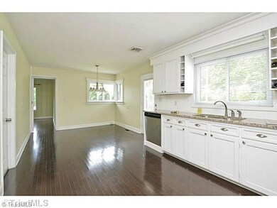 Kitchen. Euro vent hood and radiant top stove.  Lots of cabinet and drawer storage.